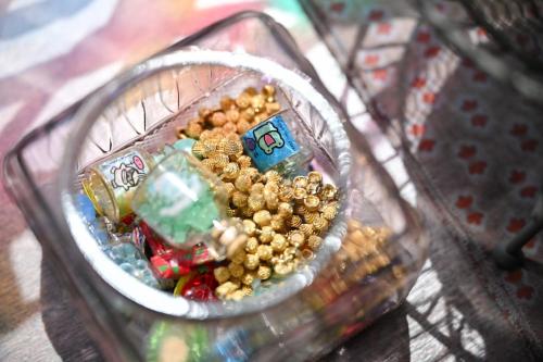 a glass container filled with peanuts and other food at Koh plus 香プラスRyokan-Style Stay Just 4 Minutes from Chino Station in Chino