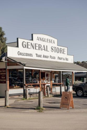 a general store with a sign in front of it at Anglesea Coastal Getaway - Prime Location in Anglesea