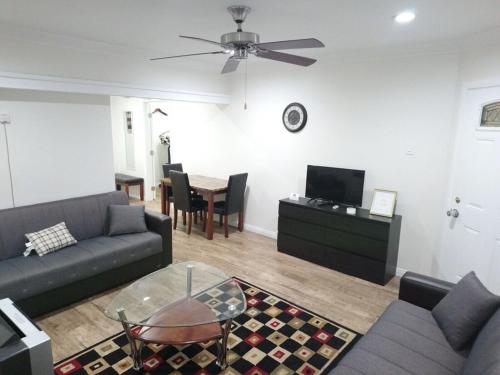 a living room with a couch and a table at Vacation Unit is Available for Business and Family Trip in Long Beach