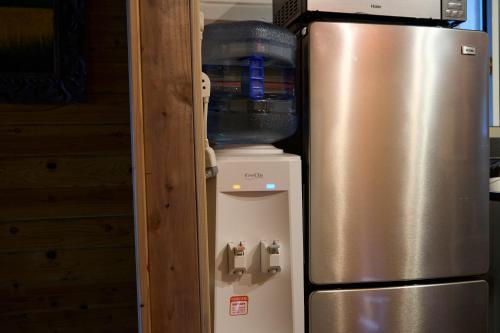 a refrigerator freezer sitting inside of a kitchen at vihrea in Ōtaki