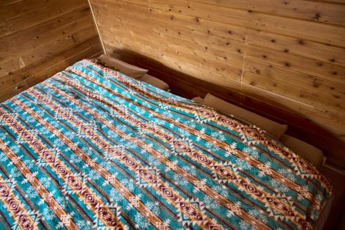 a bed in a box in a room at vihrea in Ōtaki