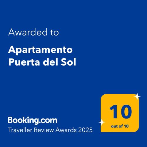 a yellow sign with the text awarded to apartment puerto del sol at Apartamento Puerta del Sol in Conil de la Frontera