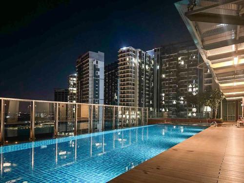 a swimming pool on the roof of a building at night at KidsVille Slide PlayNest at Afiniti, Walking to Legoland JB, Johor, Malaysia in Iskandar Puteri