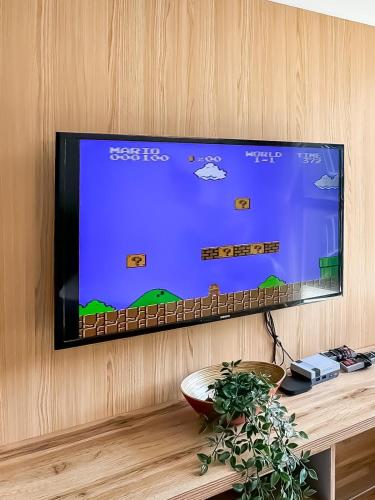 a flat screen tv hanging on a wall at KidsVille Slide PlayNest at Afiniti, Walking to Legoland JB, Johor, Malaysia in Iskandar Puteri