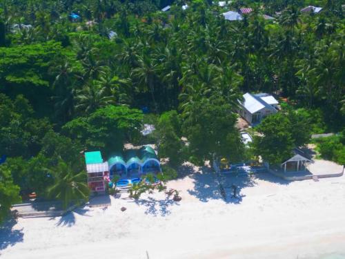 an aerial view of a resort on a beach at Noel Cottage in Ngurblut
