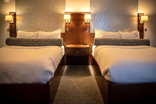 Katil atau katil-katil dalam bilik di Le Noranda Hotel & Spa, an Ascend Collection Hotel