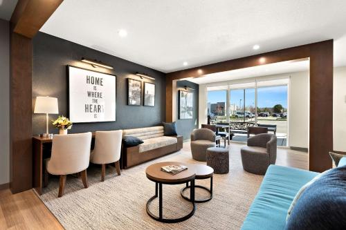 a living room with a couch and a table at Everhome Suites Nampa Boise in Nampa