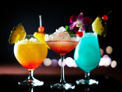 a group of three cocktails sitting on a table at Hotel Universal Port in Osaka