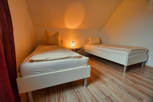 Un ou plusieurs lits dans un hébergement de l'établissement Auerhahn Ferienhäuser Auerhahn 403