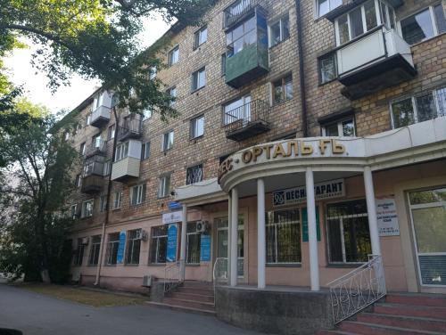 a building on the corner of a street at Назарбаева 31 шикарное жилье in Karagandy