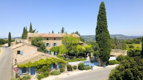 an estate in the provence with trees and a road at La Bastide Bleue in Séguret