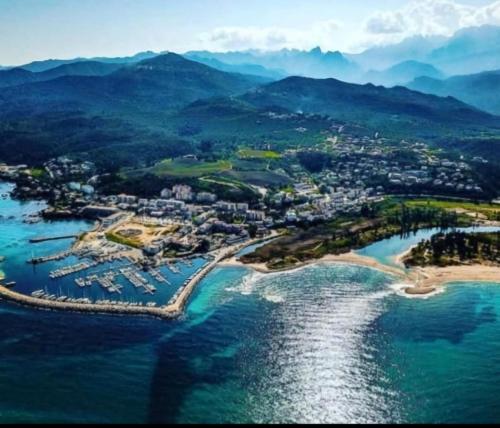 an aerial view of a resort on the water at L'Alizia in Sari Solenzara