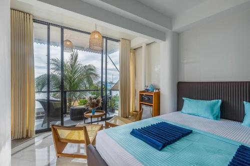 Postel nebo postele na pokoji v ubytování Peacock Beach Hotel Unawatuna