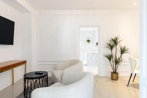 TV a/nebo společenská místnost v ubytování Fauchil Boutique Hotel