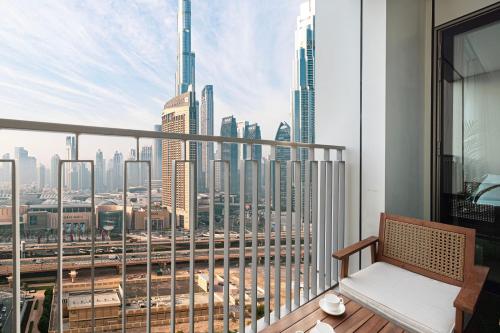 a balcony with a view of a city skyline at Fresh New 2 Bedroom! Amazing Burj Khalifa View! 5-star Pool & Gym Access! in Dubai