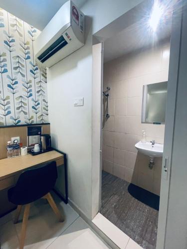 a small bathroom with a sink and a toilet at Sovotel @ Kota Damansara 8 in Kota Damansara