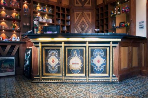a bar in a restaurant with plates on the wall at Dancenter South London Camberwell in London