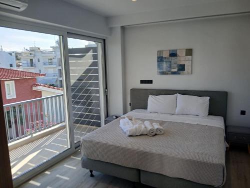 Ένα ή περισσότερα κρεβάτια σε δωμάτιο στο Utopia Suit