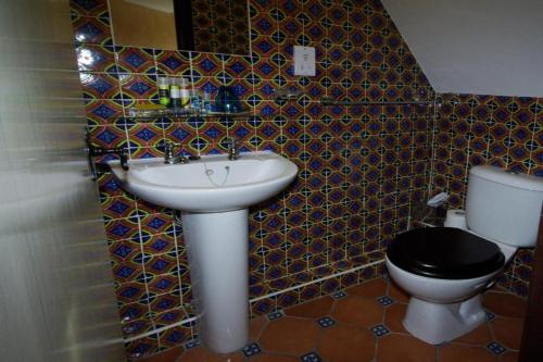 a bathroom with a sink and a toilet at Dancenter South London Camberwell in London