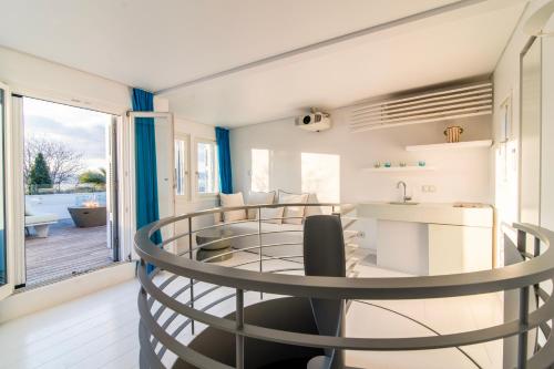 a kitchen and living room with a round dining table at Plaka Villa with Epic Acropolis Views in Athens
