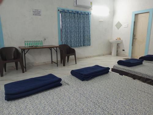 DWARKA TOURIST BUNGALOW Only Familyにあるベッド
