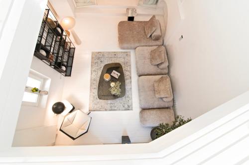 an overhead view of a living room with a couch at Plaka Villa with Epic Acropolis Views in Athens