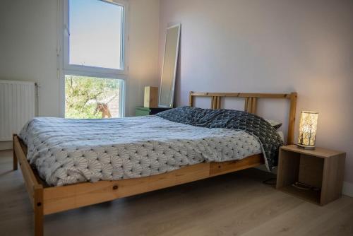 Postel nebo postele na pokoji v ubytování Magnifique appartement entre lac et montagne