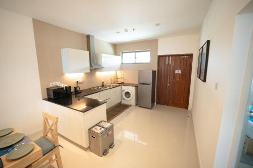 an overhead view of a kitchen with a sink and refrigerator at Oceanfront Galle by ICC in Galle