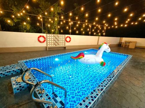 a swimming pool with a toy duck in the water at SunsetChalet 25pax Pool Snooker Bathtub Playground in Kluang