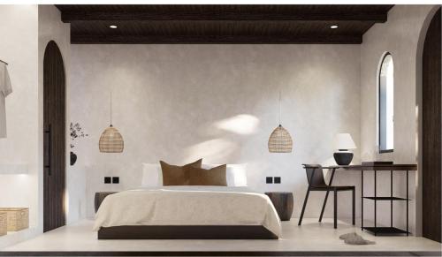 a bedroom with a bed and a table and a desk at Avaya Boutique Hostel in Legian