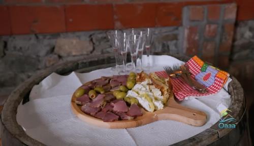 a plate of food with a hot dog on a table at Etno selo Katunija in Katun