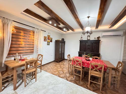 a dining room with a table and chairs at Etno selo Katunija in Katun