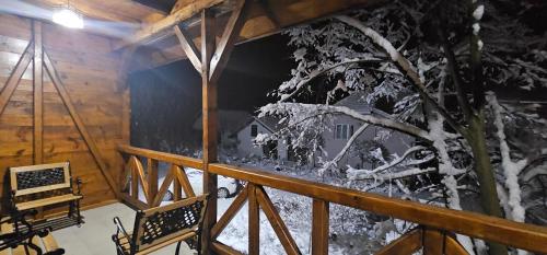 a room with a tree with snow on it at Etno selo Katunija in Katun