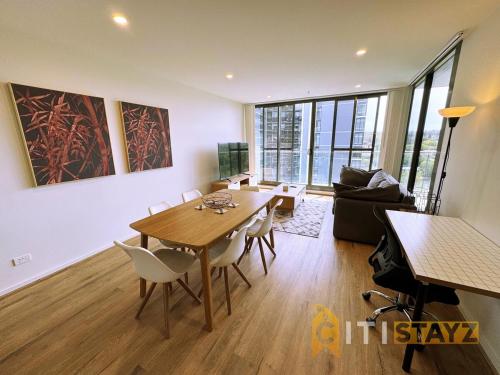 a living room with a table and chairs and a couch at Pretty in Phillip - 2bd 2bth 2Car Apt in Phillip