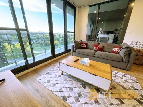 a living room with a couch and a coffee table at Pretty in Phillip - 2bd 2bth 2Car Apt in Phillip