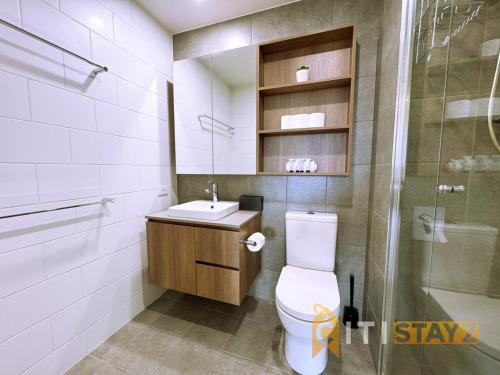 a bathroom with a toilet and a sink and a shower at Pretty in Phillip - 2bd 2bth 2Car Apt in Phillip