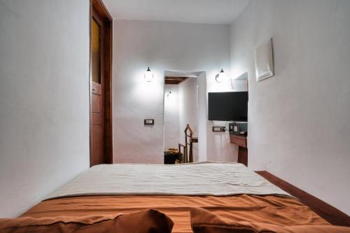 a bedroom with a large bed in a room at Ducato Dream jaccuzi Suite Imerovigli Santorini in Imerovigli