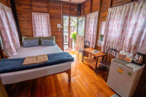Katil atau katil-katil dalam bilik di Ban Suan Bang Toei Homestay