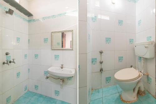 a bathroom with a toilet and a sink at Ruchishree Garden in Ujjain