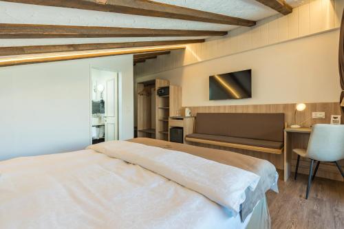 Postel nebo postele na pokoji v ubytování Hotel Beau Rivage