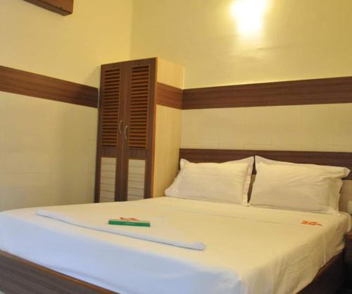 Postel nebo postele na pokoji v ubytování Hotel Kaveri Mahal