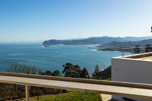 a view of the ocean from a house at El Faro de Gaztelugatxe in Bermeo