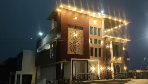 a building with lights on the side of it at Spring Valley Enclave in Kodaikānāl