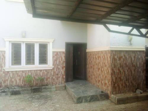 a building with a door and a window on it at Savannah Homes in Abuja