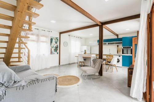 a living room with a couch and a table at Villa Kassav'ry in Capesterre-Belle-Eau