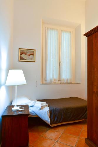 Un ou plusieurs lits dans un hébergement de l'établissement Calzaioli Apartment