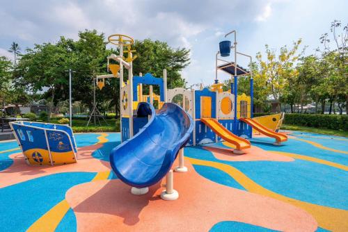 a playground with a slide in a park at Thong Dong Homestay in Phước Lý