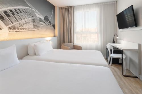 Postel nebo postele na pokoji v ubytování B&B HOTEL Valencia Ciudad de las Ciencias