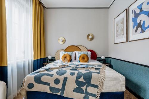 two dogs sitting on top of a bed at Colette - LoftAffair Collection in Warsaw