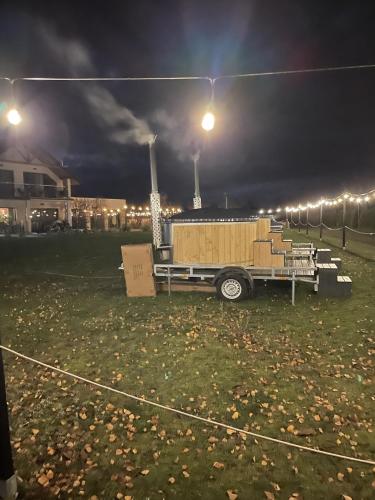 a truck parked in a field at night at Catalpa Camp Ośrodek Rekreacyjno-Wypoczynkowy nad jeziorem Gopło in Piotrków Kujawski